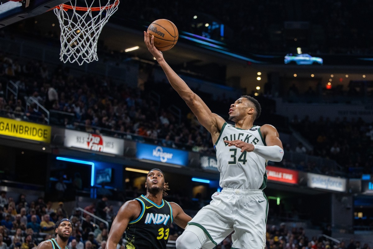 Milwaukee Bucks forward Giannis Antetokounmpo (34) shoots the ball while Indiana Pacers center Myles Turner (33) 